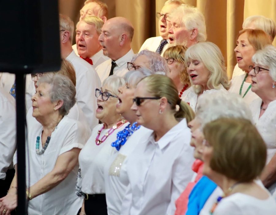 Choir members singing with passion